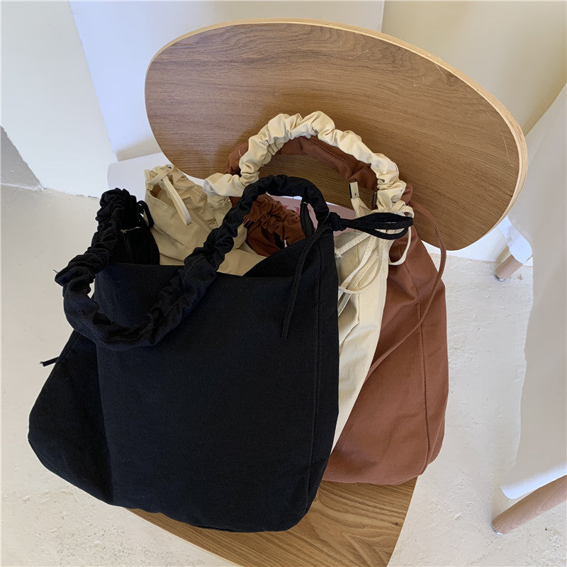 Bag women's Korean version of the new oblique span shoulder bag large capacity drawstring pleated oblique span canvas women's bag versatile dumpling bag