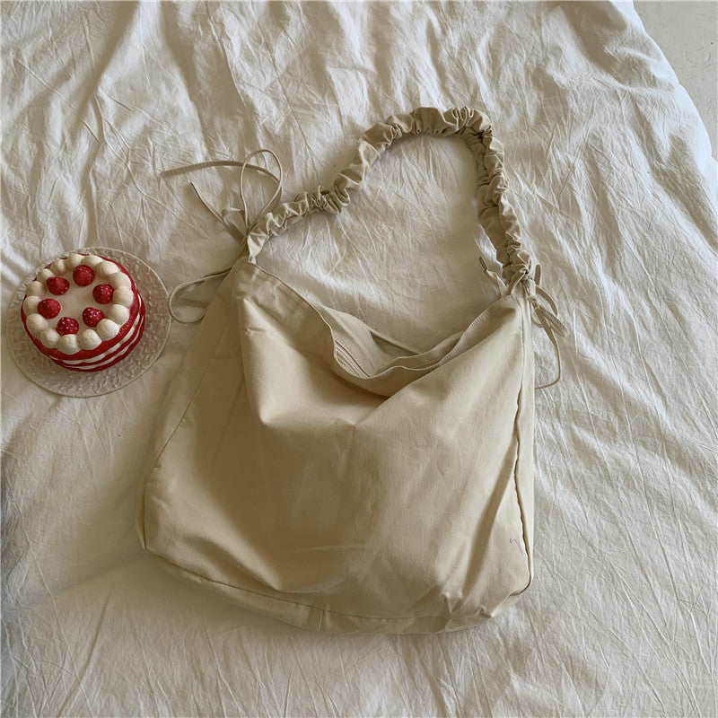 Bag women's Korean version of the new oblique span shoulder bag large capacity drawstring pleated oblique span canvas women's bag versatile dumpling bag