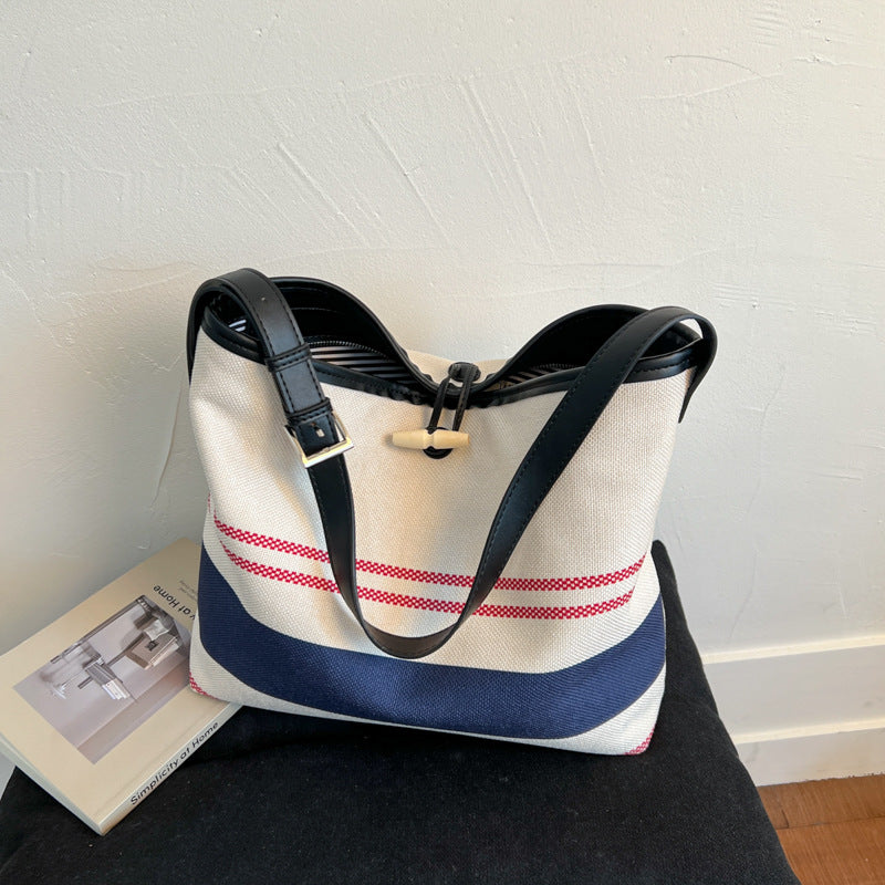 Cross-border striped canvas bag women's large capacity 2025 new summer versatile shoulder messenger bag college student tote bag