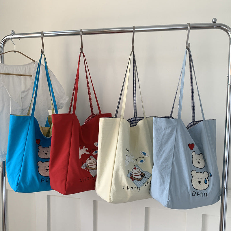 Canvas bag 2025 new women's handheld cloth bag large capacity carrying book bag junior high school students tutoring embroidered shoulder bag