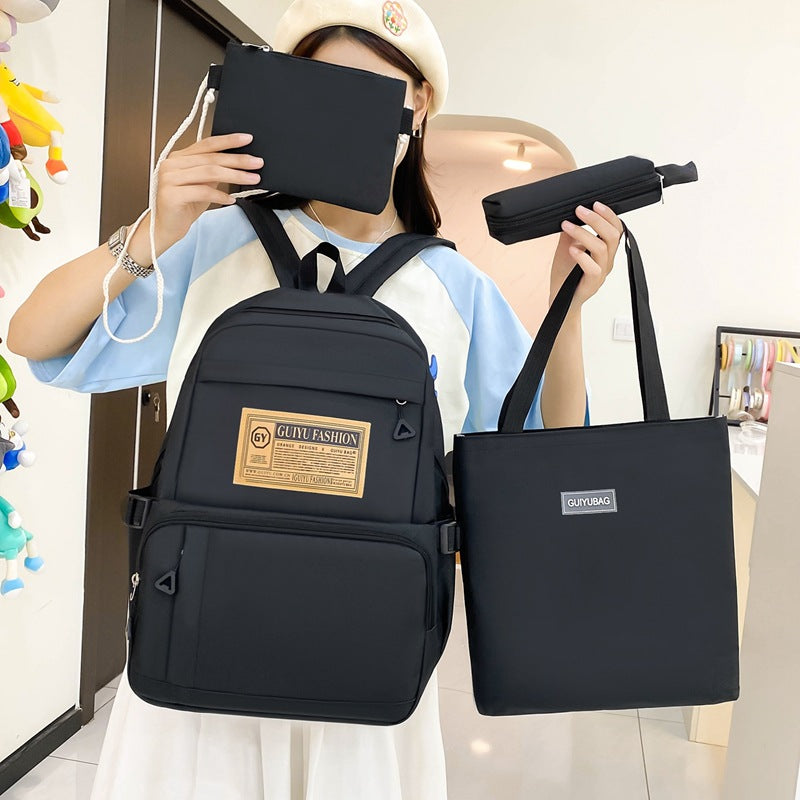 New primary and junior high school student schoolbag portable make-up bag four-piece Korean version simple backpack trendy campus backpack