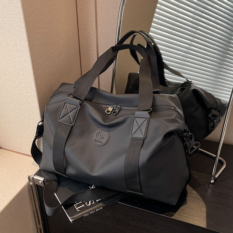 New travel bag women's travel portable hand luggage bag Korean version large-capacity messenger sports fitness bag travel bag