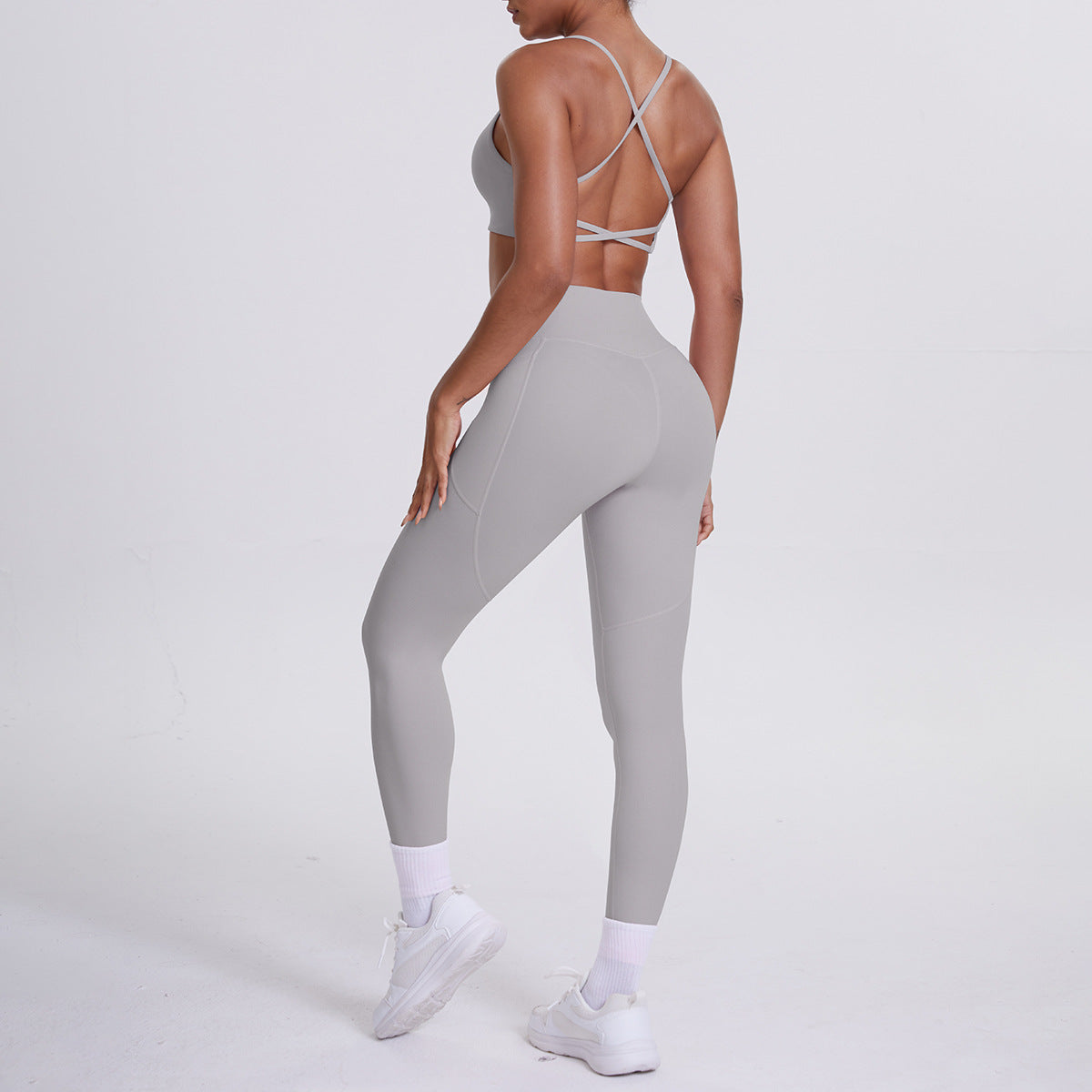 Spot European and American nude sports pocket trousers sexy suspenders sports beautiful back running fitness pants yoga suit set