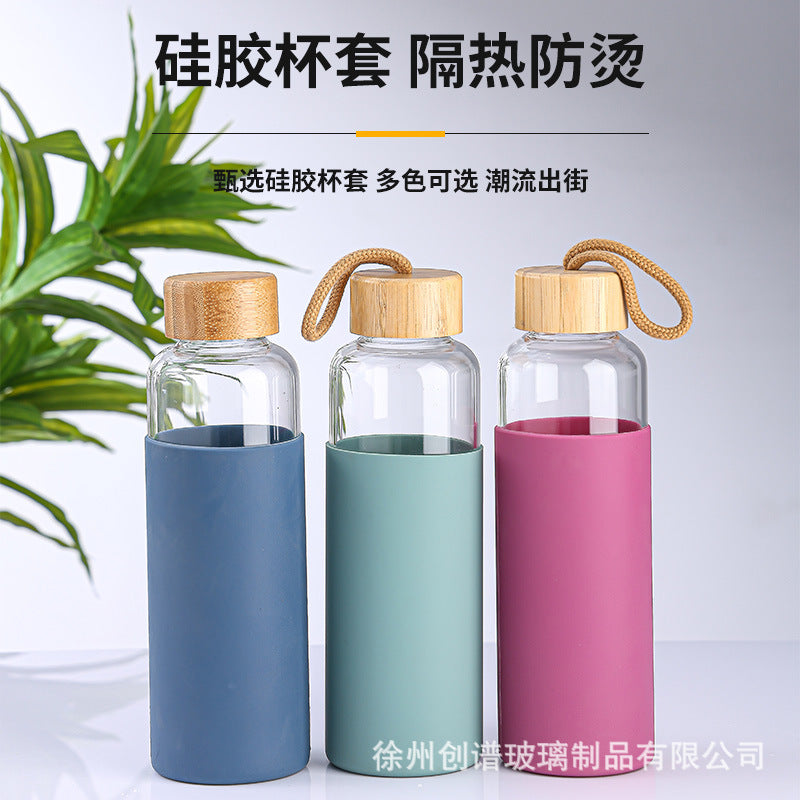 Cross-border 16oz bamboo cover with lifting rope heat-resistant silicone sleeve transparent single-layer borosilicate glass water cup printing logo