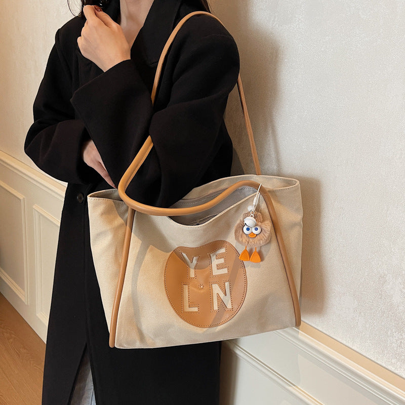 Canvas large capacity letter tote bag women's bag 2025 new casual simple handbag commuter versatile shoulder bag