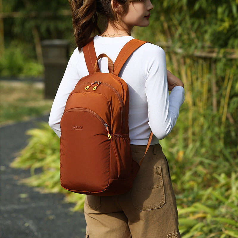 New foldable storage backpack women's travel bag simple casual nylon lightweight outdoor backpack schoolbag