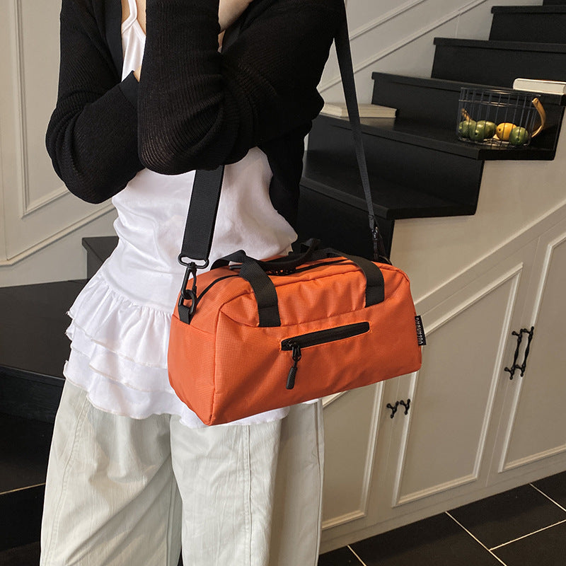 Cross-border women's lightweight handbags, large-capacity business travel bags, luggage bags, sports fitness bags, shoulder messenger bags.