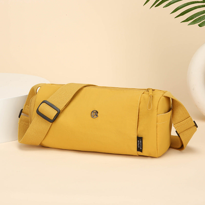 Simple Japanese shoulder bag women's nylon anti-splashing cylinder pillow bag trendy cool messenger bag commuter portable handbag