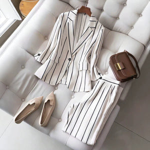 elegant vertical striped commute set: notch lapel blazer with cinched waist, paired with high-waisted, drapey wide-leg trousers for women