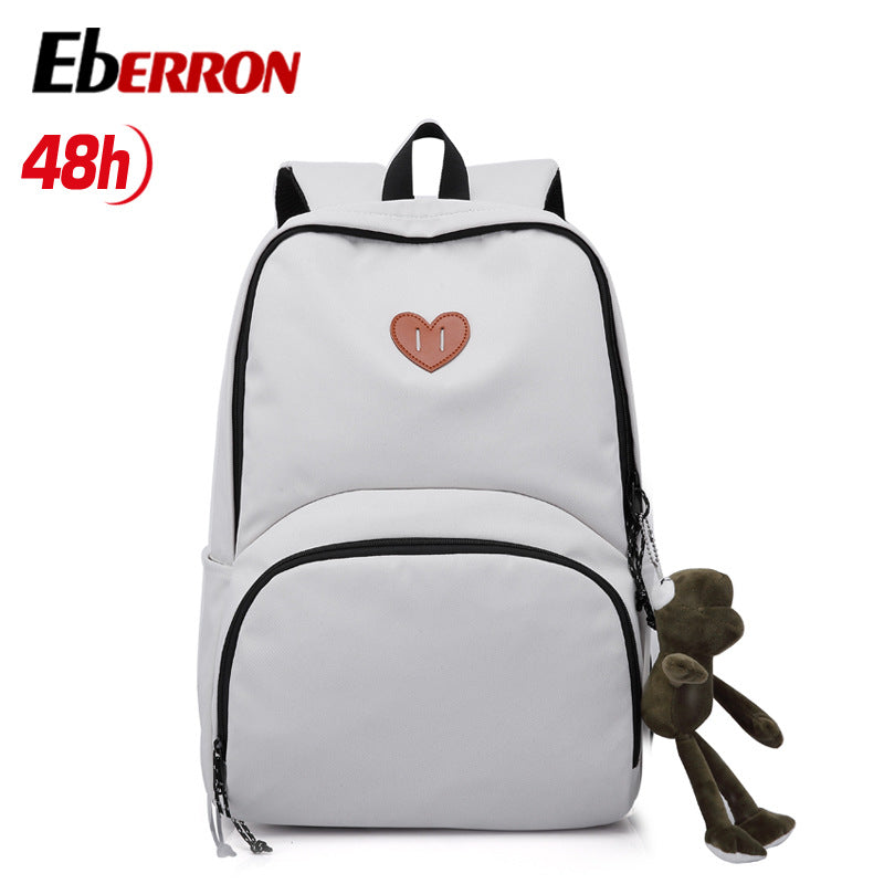 New simple and versatile schoolbag, high-value dirt-resistant belt, doll large-capacity backpack, male and female middle school student backpack.