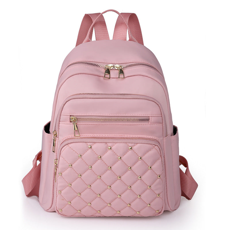 Solid color rhombus sewing line rivets fashion backpack women's 2025 texture Korean version large capacity simple women's backpack
