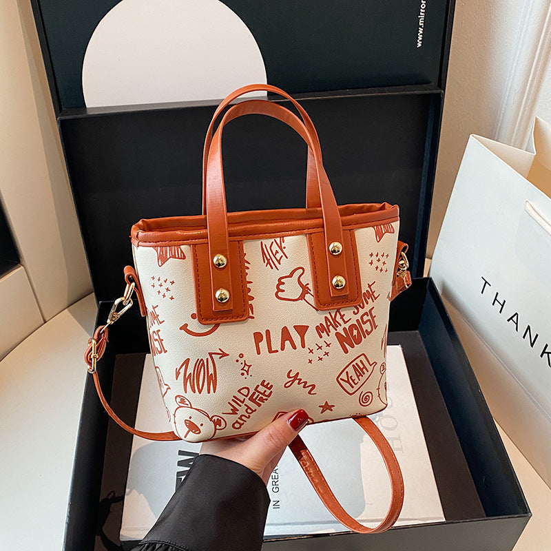 Cute cartoon printed bucket bag women 2025 new messenger bag women ins personality graffiti shoulder bucket bag