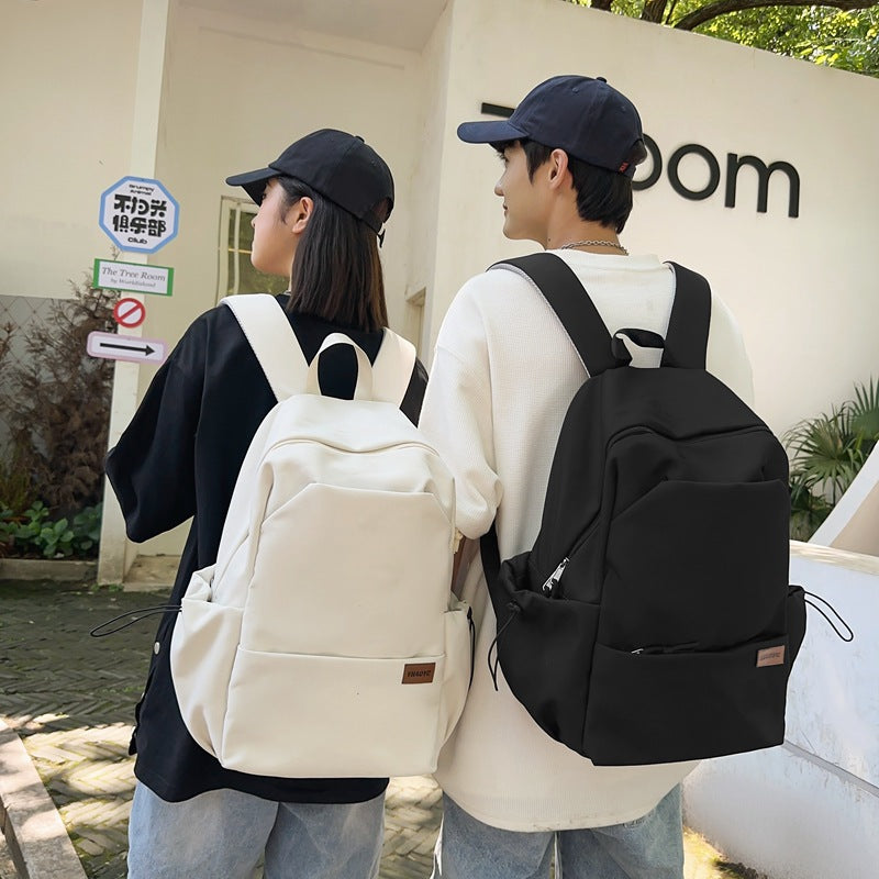 New solid color junior high school student large-capacity backpack male backpack schoolbag male college student business travel backpack