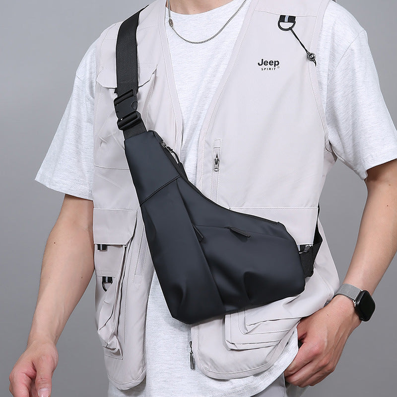 New men's light and close-fitting triangular bag, simple leather film texture shoulder messenger bag, trendy and cool casual portable breast bag