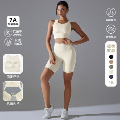 New women's two-piece activewear set: solid color compression sports bra with fixed cups and anti-odor workout shorts