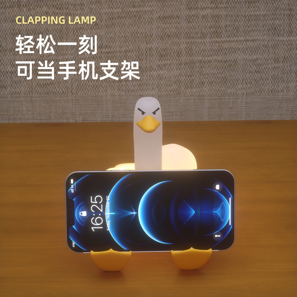 Cross-border creative silicone night light usb charging pat light bedroom bedside mobile phone holder middle finger duck desk lamp
