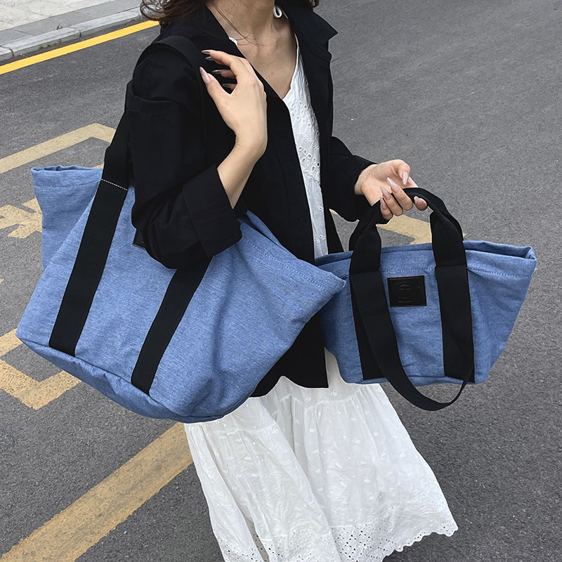 Casual large-capacity denim bag, women's 2025 new lightweight and versatile commuter shoulder bag, portable tote bag