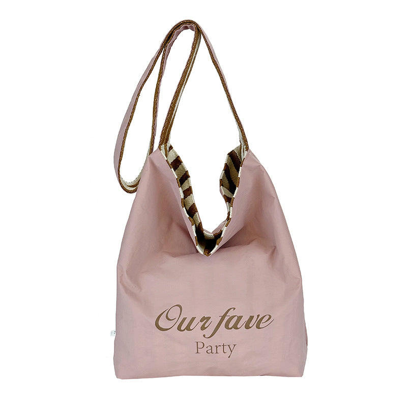 Casual large-capacity striped canvas bag women's 2025 new commuter shoulder bag lightweight versatile tote bucket bag