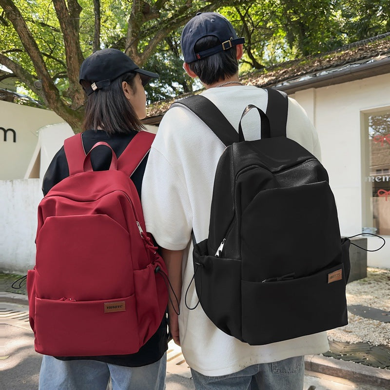 New solid color junior high school student large-capacity backpack male backpack schoolbag male college student business travel backpack