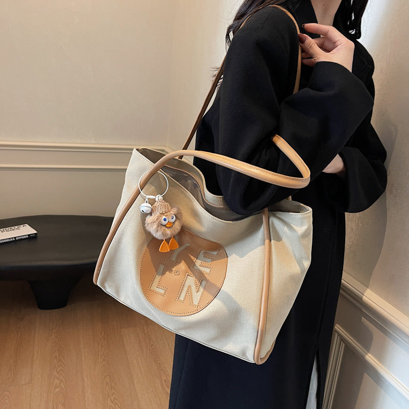 Canvas large capacity letter tote bag women's bag 2025 new casual simple handbag commuter versatile shoulder bag