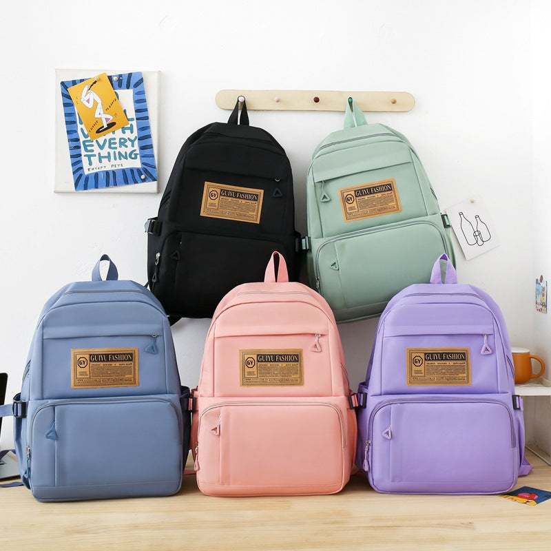 New primary and junior high school student schoolbag portable make-up bag four-piece Korean version simple backpack trendy campus backpack