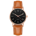 Rose gold case, black dial, brown leather strap