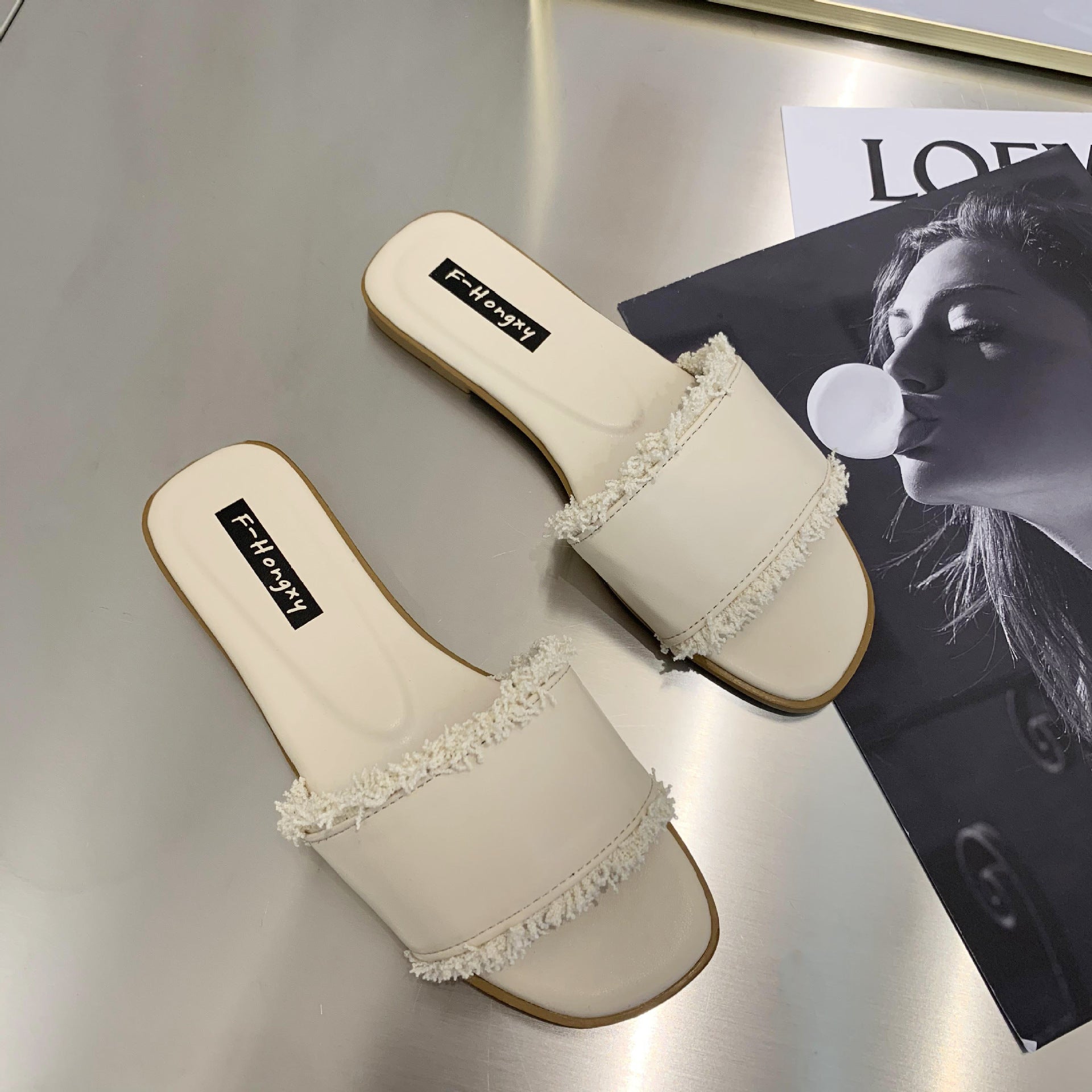 2020 summer new cool slippers women's Korean version flat-bottomed fashion outer wear one-word tassel cool slippers