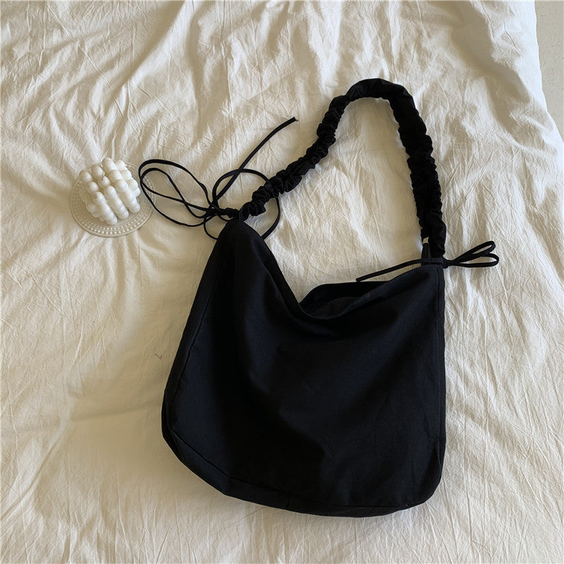 Bag women's Korean version of the new oblique span shoulder bag large capacity drawstring pleated oblique span canvas women's bag versatile dumpling bag