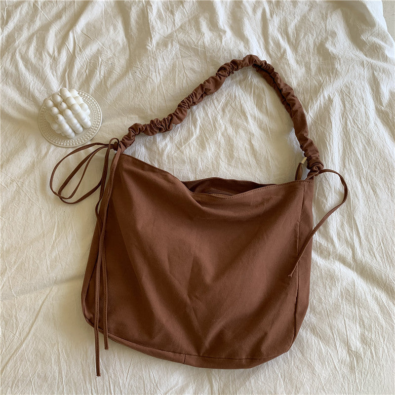 Bag women's Korean version of the new oblique span shoulder bag large capacity drawstring pleated oblique span canvas women's bag versatile dumpling bag