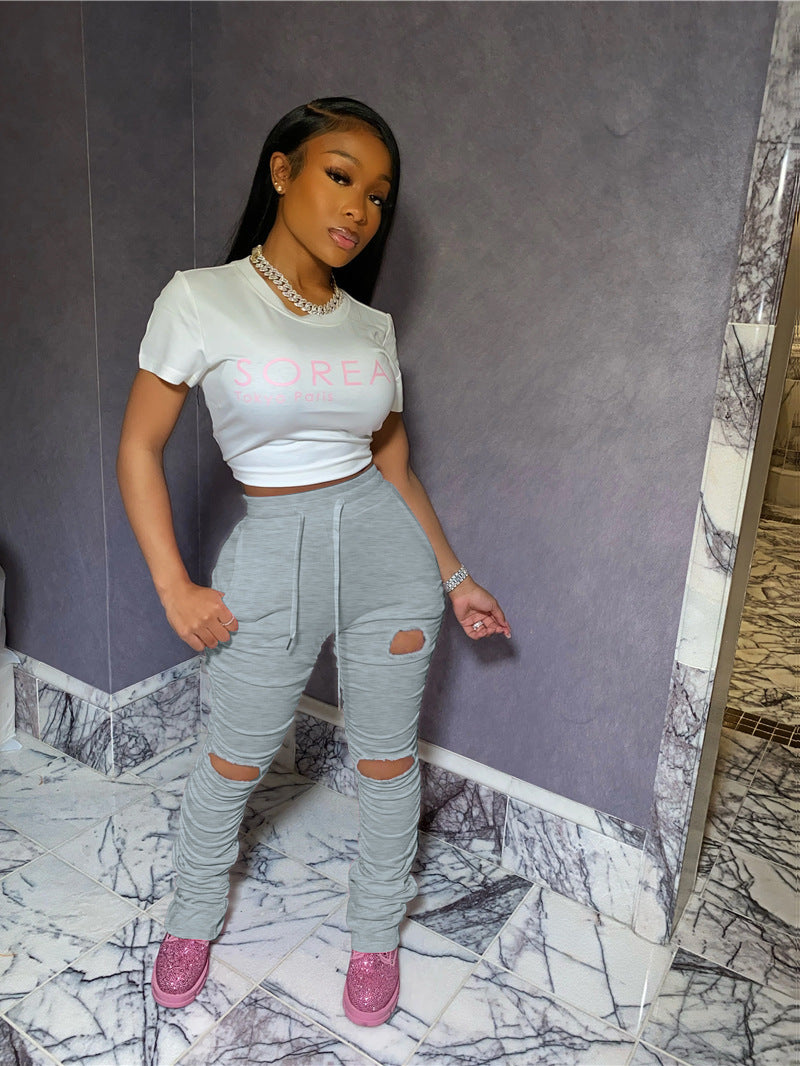 Factory hot sale: european & american style fashionable sexy butt-lifting slim-fit distressed pleated pocket micro-flare women's sweatpants
