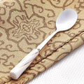 Small white spoon