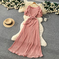 French-inspired pleated, waist-cinching, slimming dress for women. red, tie-waist, elegant, and flowy maxi dress, perfect for the office