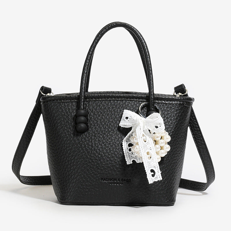 High sense fashion simple portable bucket bag women's 2025 spring and summer new casual simple solid color shoulder messenger bag