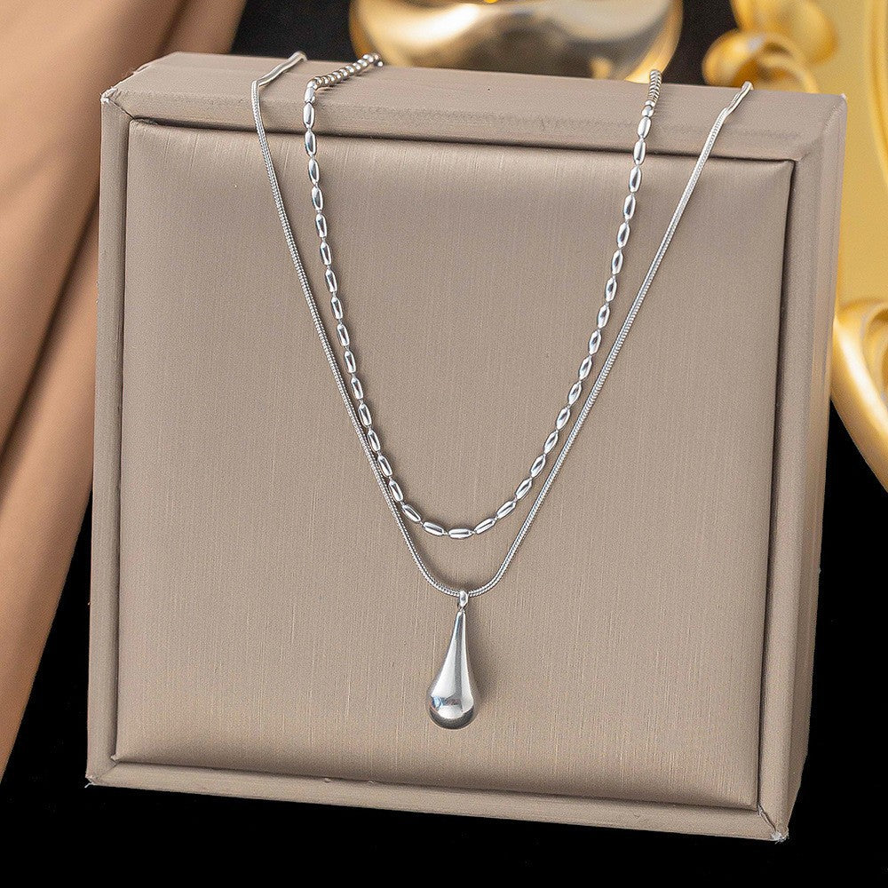 Fashionable, understated luxury: a delicate, double-layered teardrop titanium steel necklace for women. a versatile, minimalist collarbone chain that's trendy, stylish, and fade-resistant