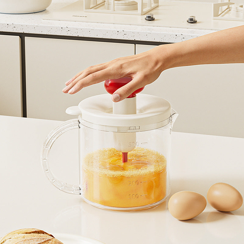 Multifunctional hand mixer with built-in whisk, press-down filter, and egg beater – perfect for cream whipping and baking