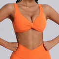 Fashionnew arrivalnude sports intimatesfemale sexy twist shockproof yoga bra beautiful back containing breast pad sports bra
