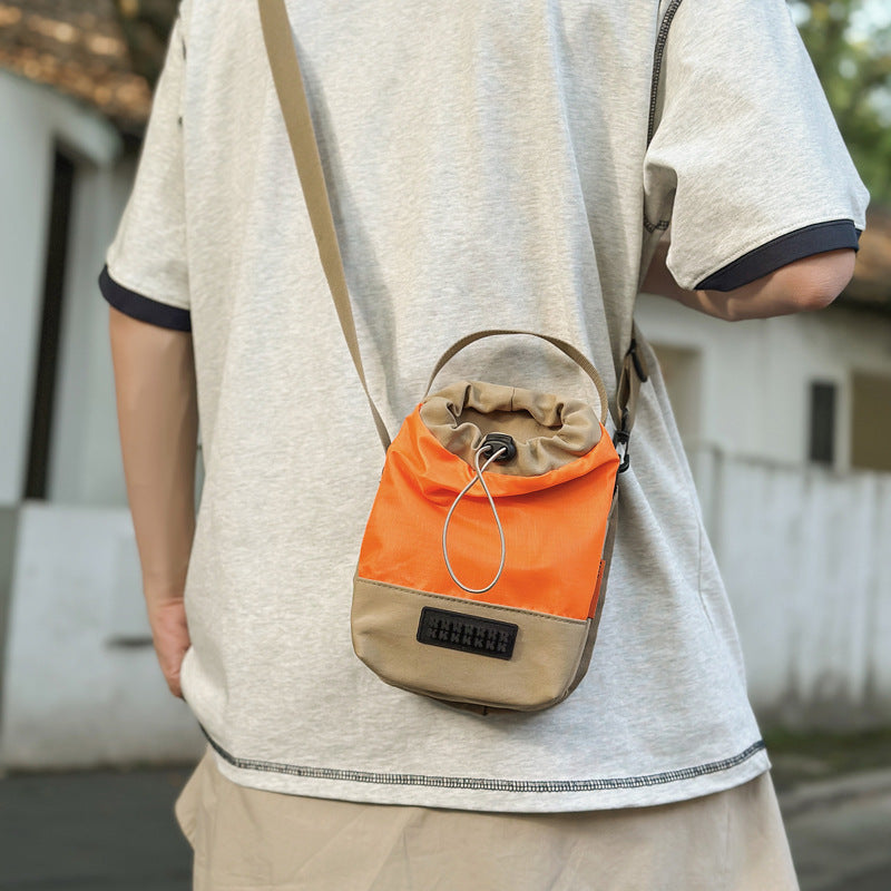 Foreign trade cute contrasting color draw belt small bag women 2025 new versatile sports and leisure shoulder messenger bag cloth bag