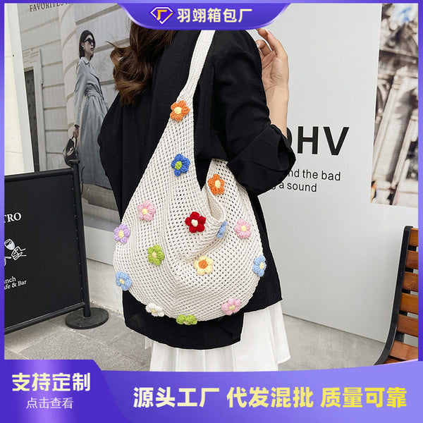 Cross-border woven bag women's 2025 new Korean version shoulder tote bag lazy wind knitted hollow flower beach bag