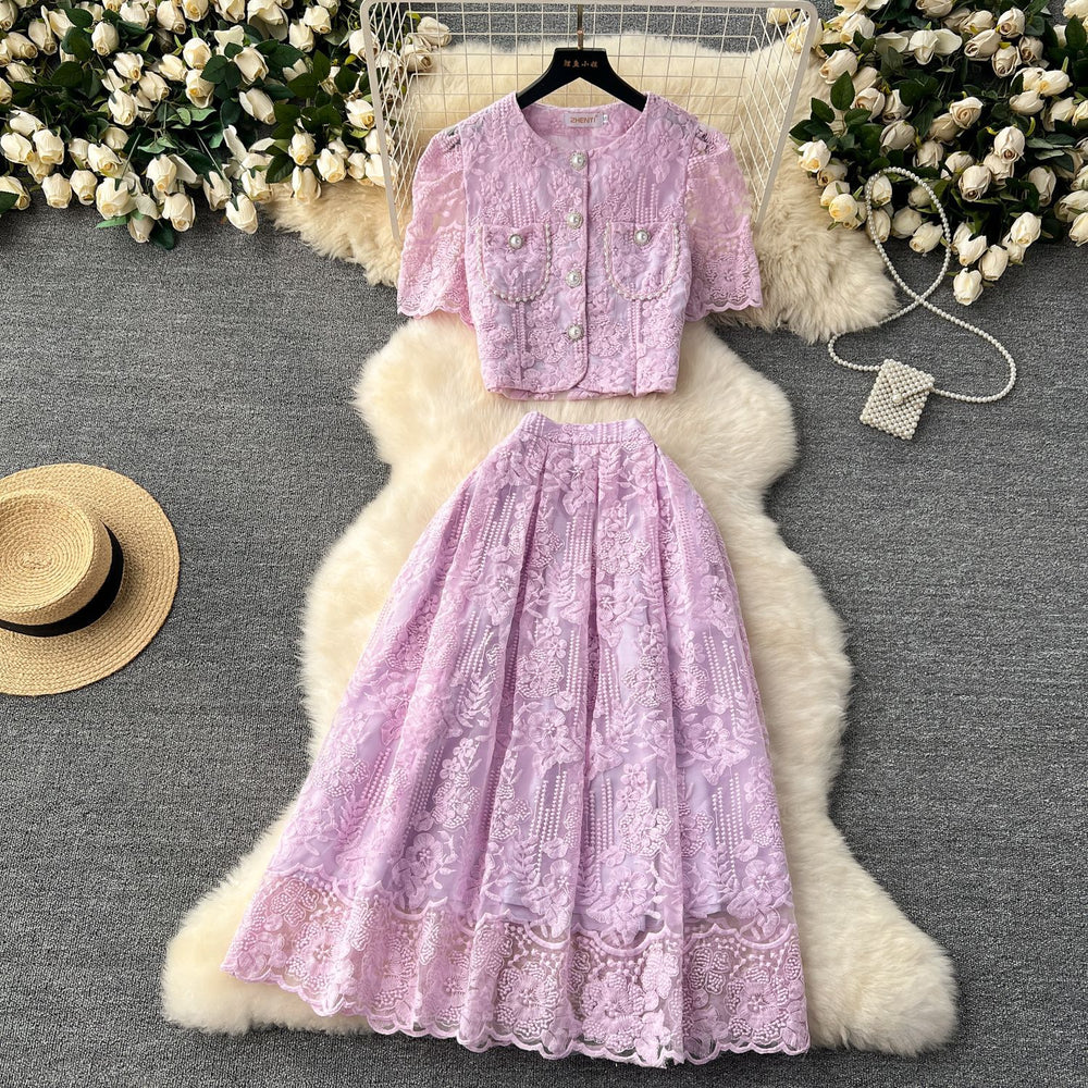 High-end, sophisticated, and feminine two-piece set for women. features a french-style lace crochet blouse with puff sleeves and a high-waisted, slimming midi skirt
