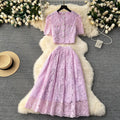 High-end, sophisticated, and feminine two-piece set for women. features a french-style lace crochet blouse with puff sleeves and a high-waisted, slimming midi skirt