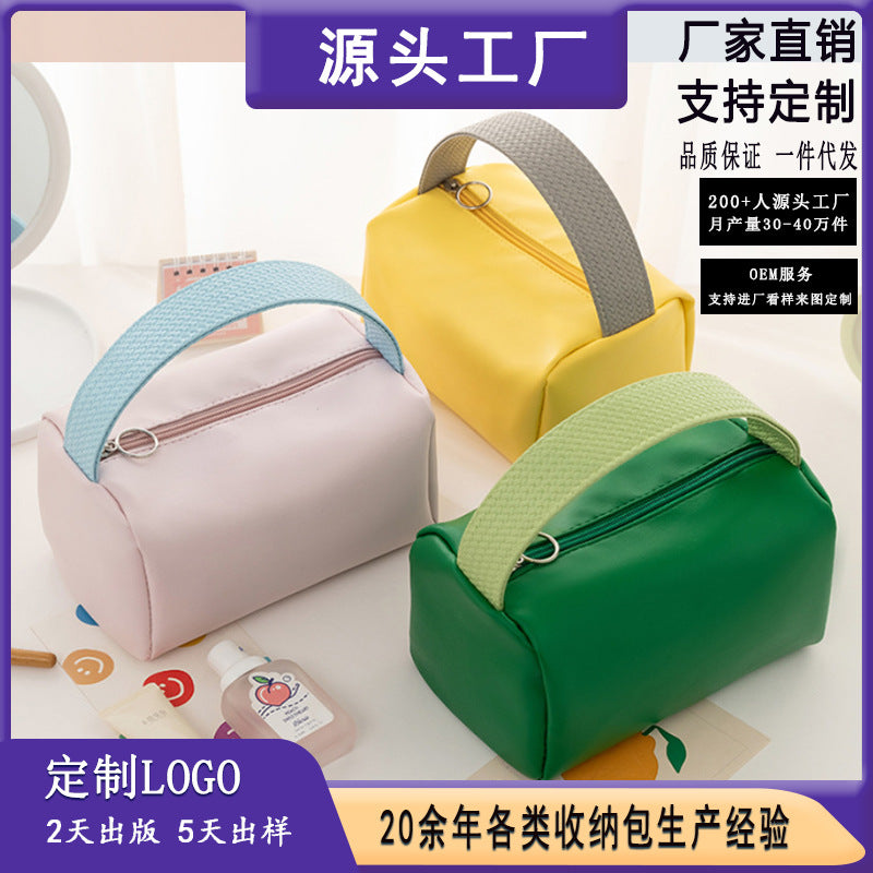 Portable cosmetic bag, new candy color, large-capacity storage bag, finishing bag, cosmetics, portable toilet bag, wholesale.