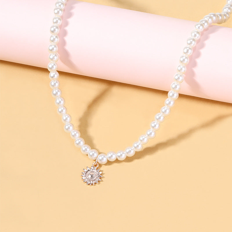 Pearl necklace wholesale fashion cross-border pendant jewelry alloy sun niche light luxury high-end sweater necklace for women