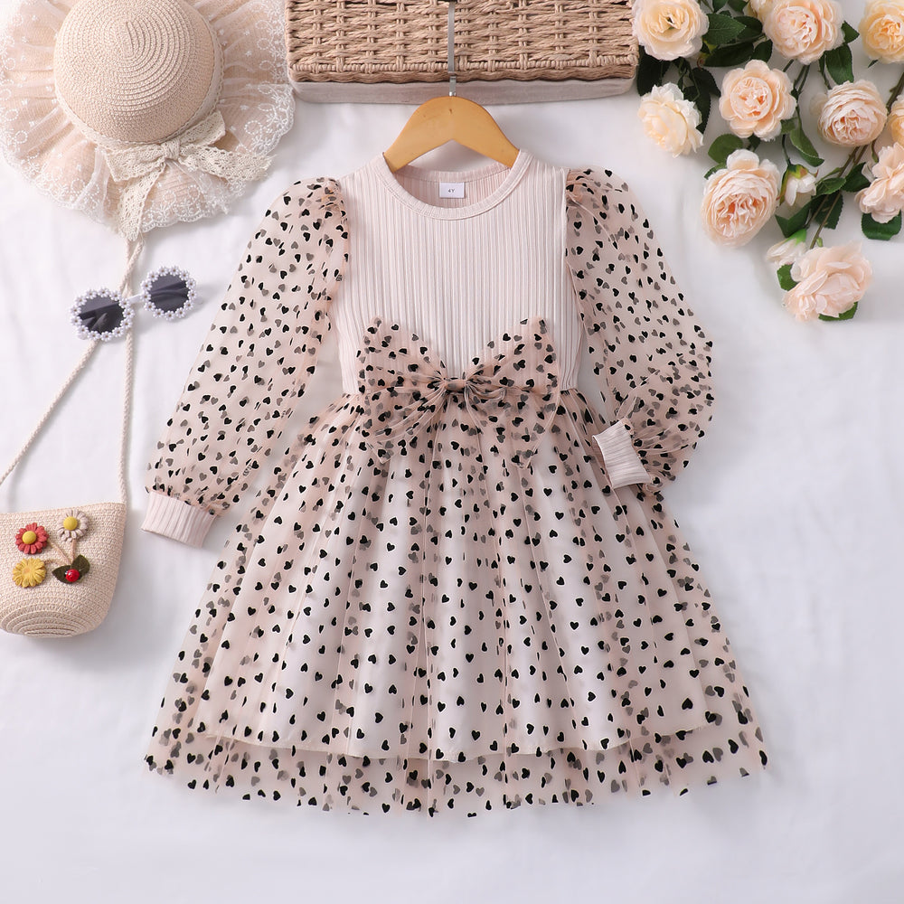 Girls' dress for toddlers and young children, featuring a bow, heart, and polka dot mesh skirt