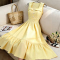 new european and american style cream yellow square neck sleeveless dress with pearl button detail, cinched waist, and pleated midi skirt