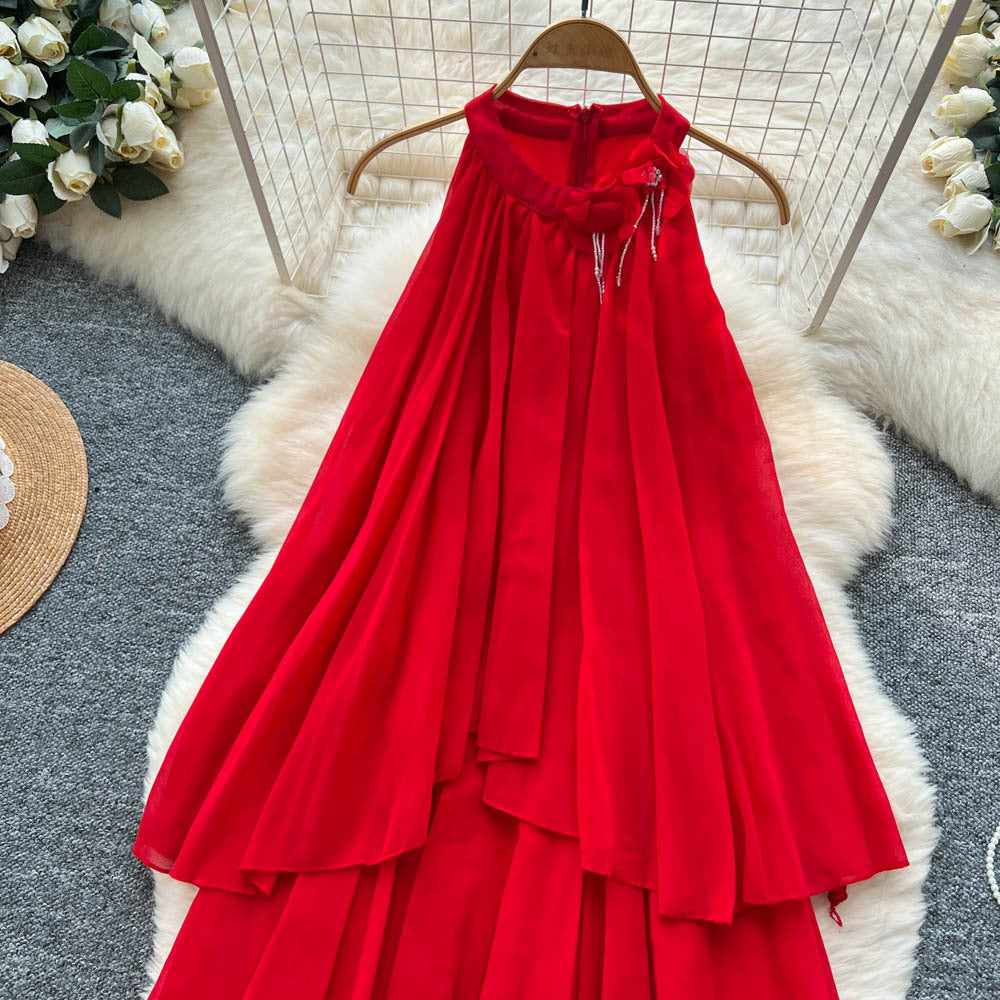 French-inspired, three-dimensional floral halter neck sleeveless dress for women. loose-fitting, slimming, casual, and featuring an asymmetrical hem in a vibrant red