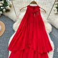 French-inspired, three-dimensional floral halter neck sleeveless dress for women. loose-fitting, slimming, casual, and featuring an asymmetrical hem in a vibrant red