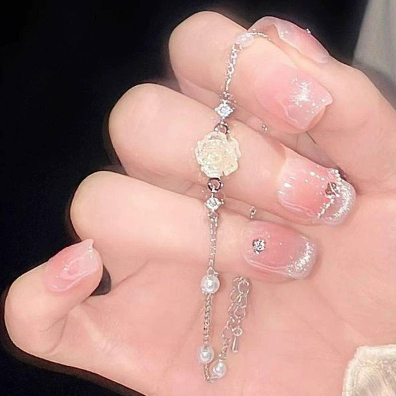 French camellia pearl bracelet for women, 2026 new arrival, light luxury niche style, lightweight luxury fashionable versatile hand jewelry