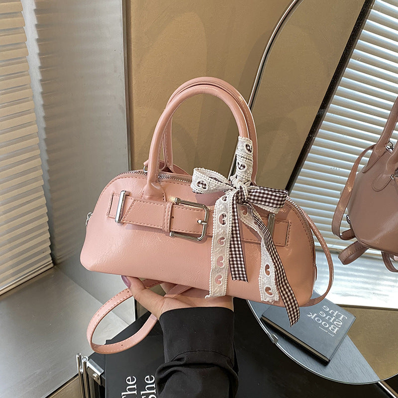 Dopamine girl hand shell bag 2025 spring and summer new Korean version shoulder bag fashion niche casual shoulder bag