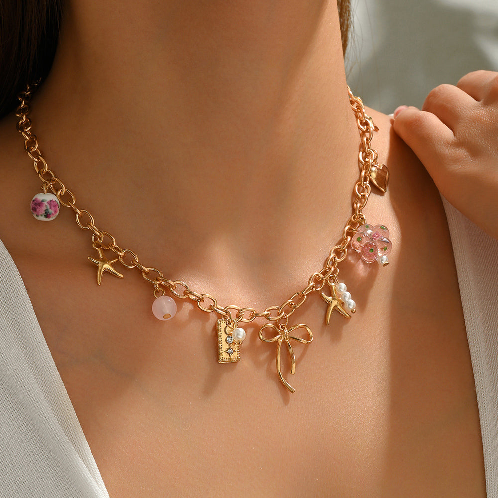 Wholesale bowknot necklaces, cross-border new floral heart pendants, women's niche high-end ceramic bead bracelet accessories