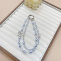 Ins style handmade pearl double chain mobile phone case lanyard creative rhinestone rocking horse pendant wrist crystal one piece dropshipping